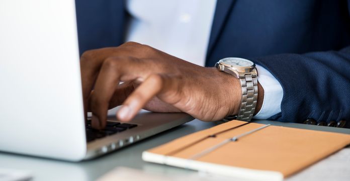 professionals talking over paper on a table